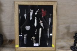 A SELECTION OF SILVER AND WHITE METAL BOOKMARKS, FRUIT KNIFE ETC MOUNTED IN A OAK GLAZED FRAMED