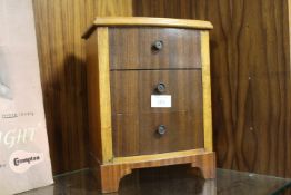 A VINTAGE MINIATURE CHEST OF DRAWERS