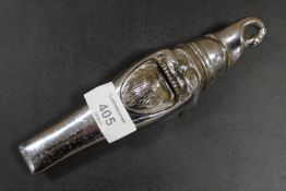 AN ANTIQUE NOVELTY CHROMED NUT CRACKER IN THE FORM OF A GNOME