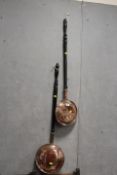 TWO ANTIQUE LONG HANDLED COPPER WARMING PANS