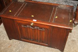 AN OAK PANELLED BLANKET BOX