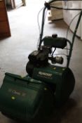 A QUALCAST CLASSIC PETROL MOWER WITH BOX