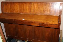 A MODERN UPRIGHT BALDWIN PIANO