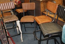 A HARLEQUIN SET OF FOUR LEATHER BAR / KITCHEN STOOLS