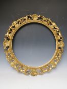 A 19TH CENTURY CIRCULAR CARVED WOODEN GOLD FLORENTINE FRAME, frame W 9.5 cm, rebate Dia. 51 cm