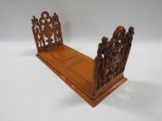 AN EARLY 20TH CENTURY GOTHIC BOOK SLIDE, extending to 48.5 cm