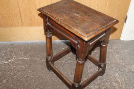 A LATE 17TH CENTURY OAK JOINT STOOL, raised on turned supports untied by a stretchers, H 58 cm, W 46