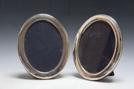 A PAIR OF HALLMARKED SILVER OVAL EASEL BACKED PHOTO FRAMES, approx height 22 cm Condition Report: