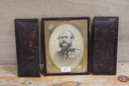 G. DOWNES (XIX-XX). An oval portrait of an officer with medals, signed lower right, pencil