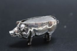 A NOVELTY HALLMARKED SILVER PIG PIN CUSHION BY ADIE AND LOVEKIN LTD - BIRMINGHAM 1905. W 5.5 cm