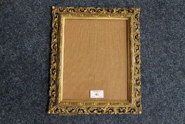 A 19TH CENTURY PIERCED GOLD FRAME, with strut back, glazed, frame W 4 cm, rebate 24 x 19 cm