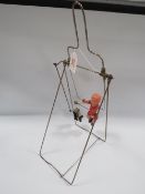 A VINTAGE CLOCKWORK 'CHILD ON A SWING', with metal frame, overall H 44 cm