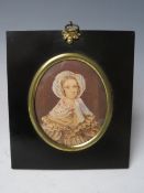 A 19TH CENTURY OVAL PORTRAIT MINIATURE OF HANNAH JAMES AGED 26, see verso, unsigned, watercolour
