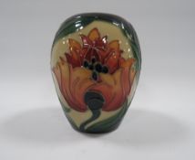 A MODERN MOORCROFT FIRE FLOWER PATTERN VASE, bullet shaped, designed by Rachel Bishop, 2005,