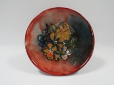 A MOORCROFT FLAMBE FOOTED BOWL WITH SPRING FLOWERS DESIGN, impressed and painted marks to base H 5.5