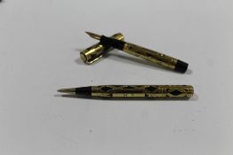 A VINTAGE CASED SET OF WATERMANS FOUNTAIN PEN AND PROPELLING PENCIL, both decorated with yellow