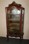 AN EARLY 20TH CENTURY LOUIS XV STYLE DISPLAY CABINET, with gilt metal mounts, the interior with