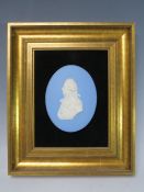A WEDGWOOD JASPERWARE OVAL PLAQUE DEPICTING ADMIRAL LORD NELSON, framed 12 x 9 cm