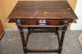 A MID 17TH CENTURY OAK COUNTRYMADE JOINTED SIDE TABLE, with a single frieze drawer, raised in barrel