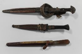 THREE ANTIQUE NORTH WEST AFRICAN TRIBAL ART DAGGERS AND KNIVES WITH SHEATHS