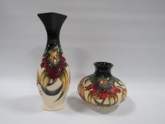 TWO MOORCROFT 'ANNA LILY' PATTERN VASES, comprising a slender vase with squared rim, H 21 cm, and