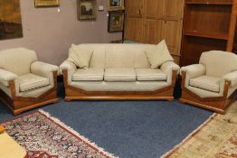 AN ART DECO WALNUT FRAMED THREE PIECE SUITE, of typical angular form