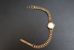A HALLMARKED 9 CARAT GOLD LADIES WRIST WATCH, approx weight 10.5g, Dia 1.5 cm