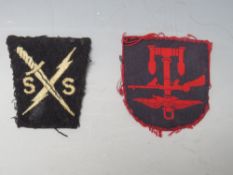 A COMBINED OPERATIONS FORMATION SIGN, printed red on navy, together with a Special Service Brigade