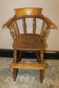 A CHILDS ANTIQUE WINDSOR STYLE HIGH CHAIR
