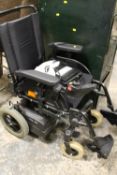 AN INVACARE POWERED WHEELCHAIR