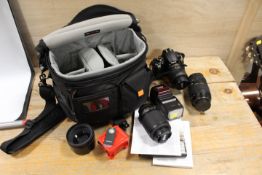 A CASED NIKON D5000 CAMERA TOGETHER WITH A SELECTION OF LENSES AND ACCESSORIES - TO INCLUDE NIKON