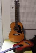 A VINTAGE ACOUSTIC GUITAR TOGETHER WITH A SMALL UNSTRING EXAMPLE (2)
