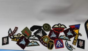 A SELECTION OF MILITARY CLOTH BADGES