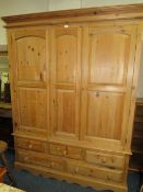 A LARGE TRIPLE MODERN PINE WARDROBE WITH DRAWERS BELOW - H 209 cm, W 160 cm
