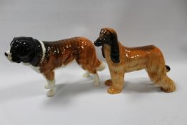A BESWICK AFGHAN HOUND TOGETHER WITH A ST BERNARD (2)