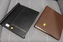 TWO FOLDERS CONTAINING LARGE QUANTITY OF STAMPS