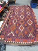 A LARGE WOOLLEN RUG 300 cm x 180 cm