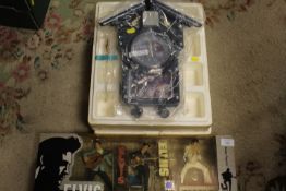 A MCFARLANE TOYS ELVIS THROUGH THE YEARS MODELS TOGETHER WITH A ELVIS CUCKOO CLOCK