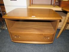 A MODERN ERCOL TV CABINET WITH DROP LEAF - W 72.5 cm