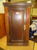 A SMALL VINTAGE OAK CORNER CUPBOARD
