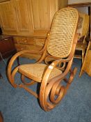 A VINTAGE BERGERE ROCKING CHAIR