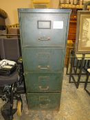 A VINTAGE METAL FOUR DRAWER FILING CABINET