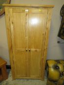 A MODERN TWO DOOR OAK EFFECT CUPBOARD - H 151 cm, W 75 cm