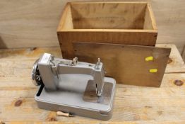 AN ESSEX MINIATURE SEWING MACHINE IN WOODEN BOX