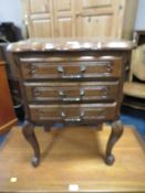 A SMALL FRENCH STYLE OAK THREE DRAWER CHEST