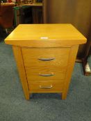 A MODERN LIGHT OAK BEDSIDE THREE DRAWER CHEST