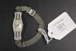 A WHITE METAL COCKTAIL WATCH STAMPED 9C