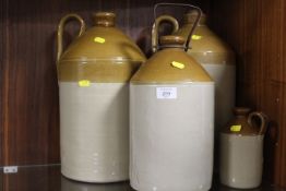 FOUR STONEWARE FLAGONS