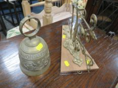 A DECORATIVE BRASS BELL AND BRACKET