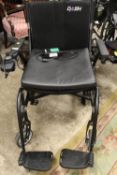 A DASH FOLDING LIGHTWEIGHT POWERED WHEELCHAIR WITH CHARGER